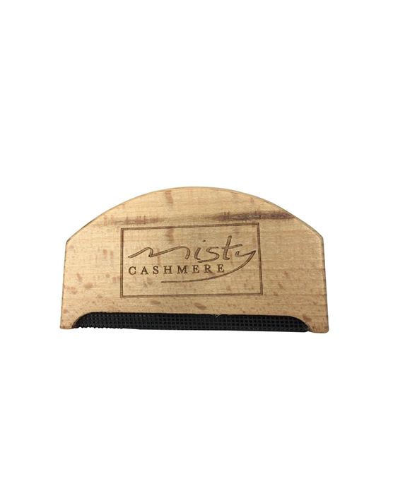 Wooden comb with 'Misty Cashmere' branding for removing pilling on a white background