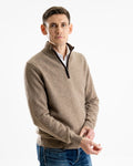 Man wearing a brown sweater in yak yarn with a boiled wool zip trim over a white shirt on a white background