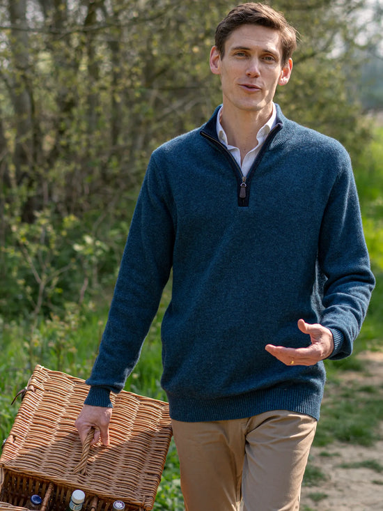 man going on a picnic by the river wearing a quarter zip neck jumper sweater with boiled wool trim from misty cashmere