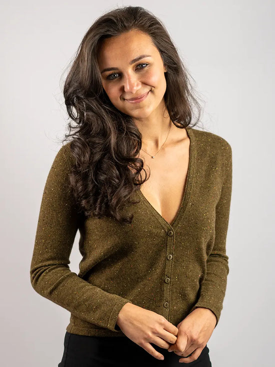 woman wearing moss fleck cardigan with sustainable corozo nut buttons by misty cashmere